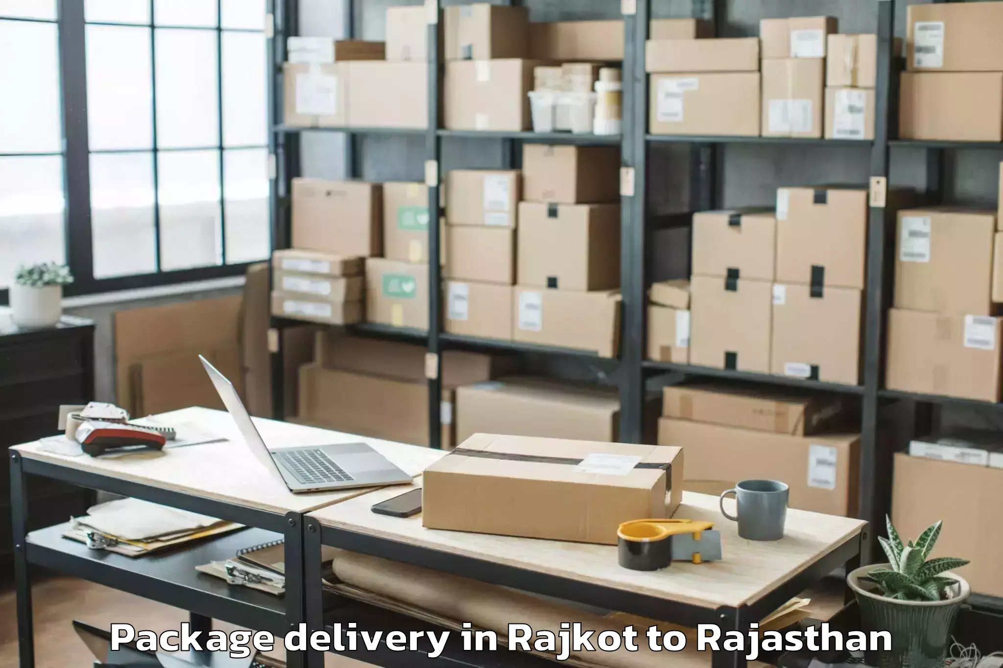 Trusted Rajkot to Dr Kn Modi University Newai Package Delivery